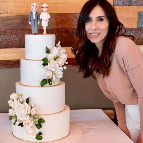 Dawn Ricca and one of her masterpiece cakes